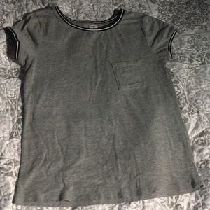 Grey shirt with black and white stripes around